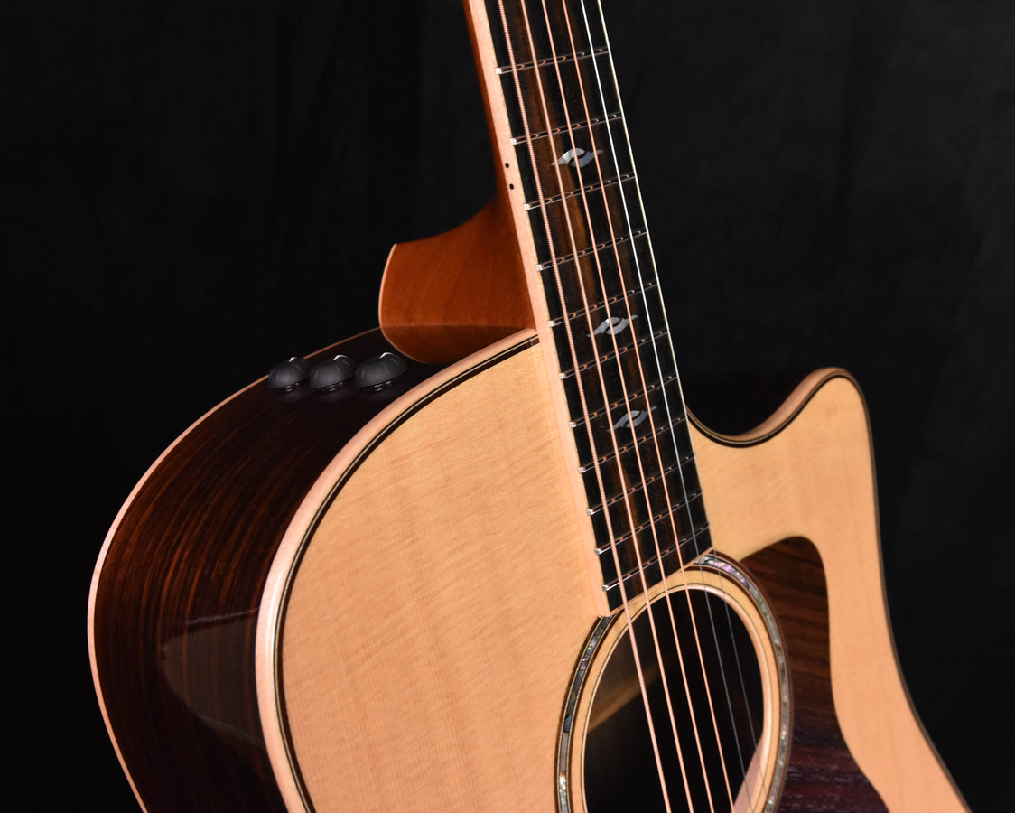 Used Taylor 810 CE guitar close-up: neck, fretboard, and upper body near strap button