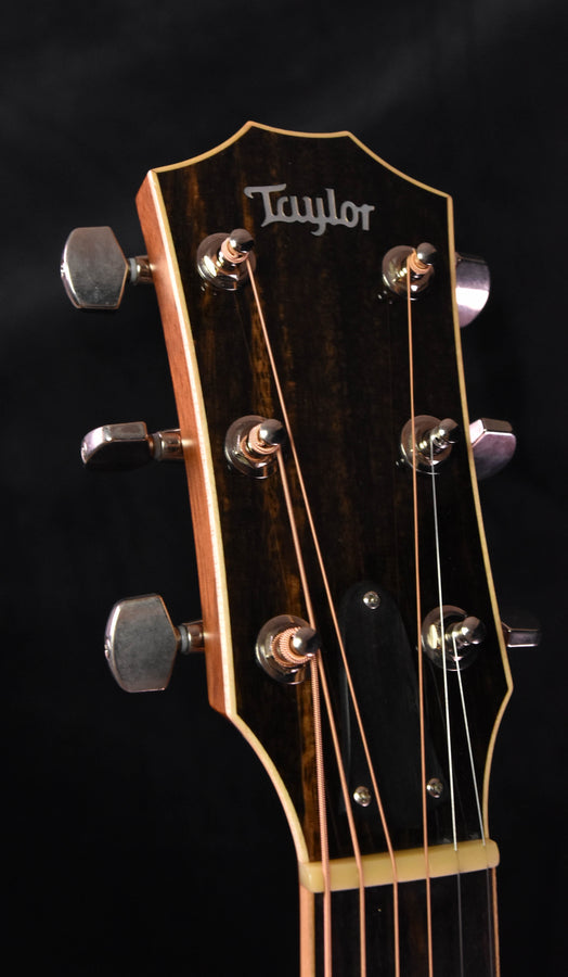 Used Taylor 810 CE headstock close-up with tuning pegs and “Taylor” logo