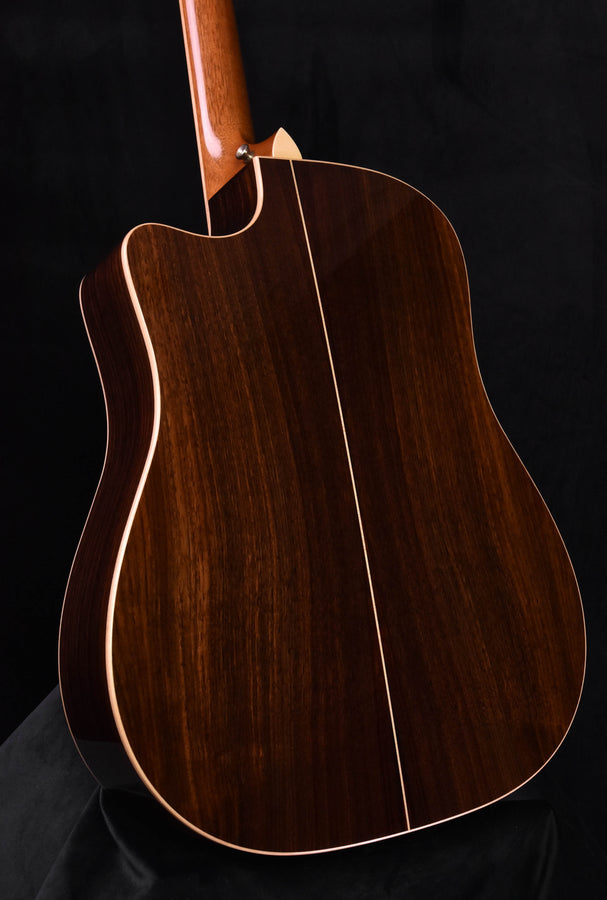 Used Taylor 810 CE guitar back and side view in dark wood with natural binding