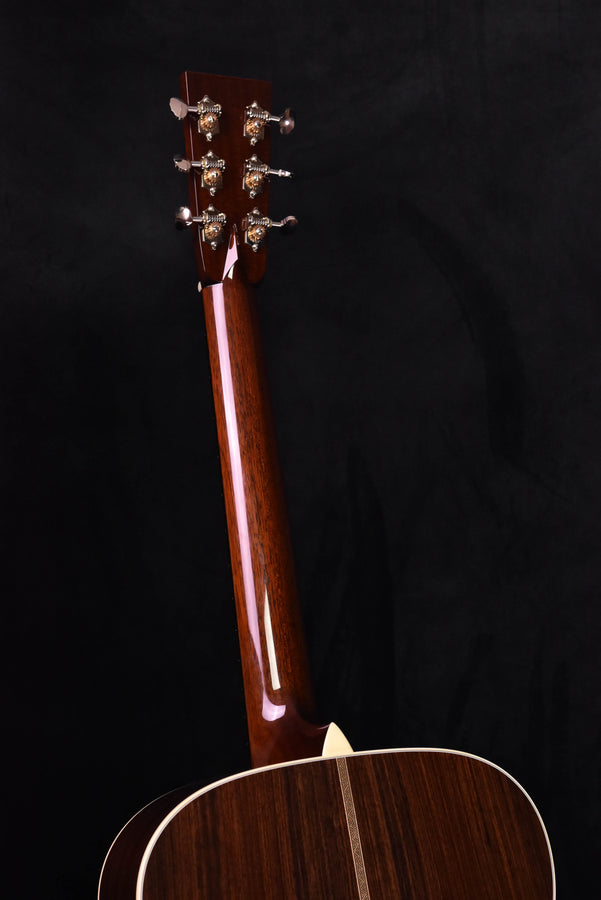 Used acoustic guitar headstock with six tuning pegs and glossy dark wood finish