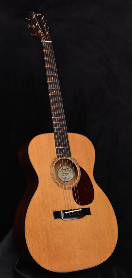 Acoustic orchestral guitar with aged-tone Sitka spruce top and natural wood body.