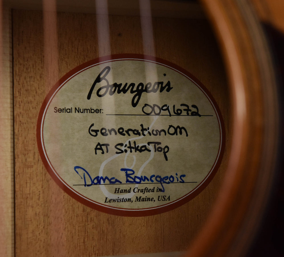 Label inside guitar with serial number and craftsmanship text
