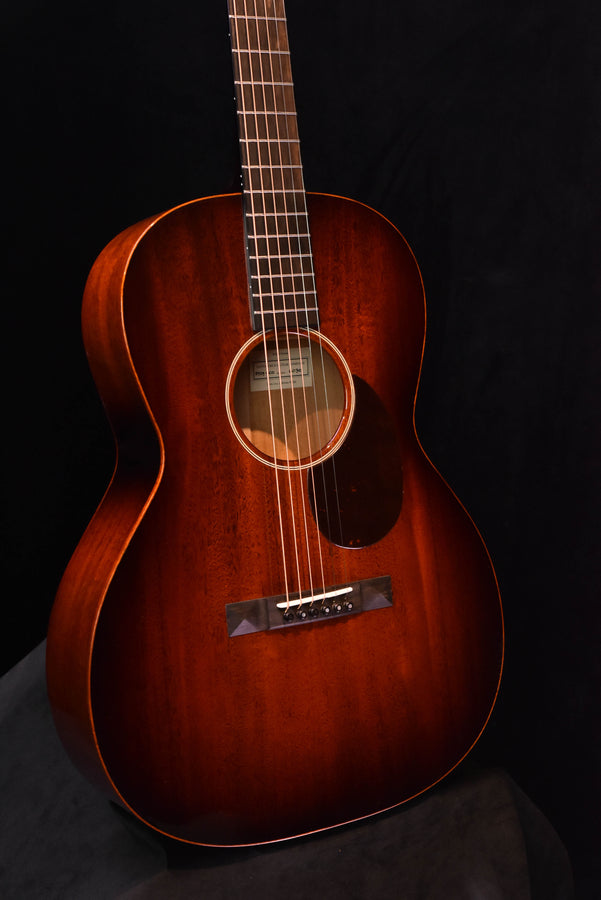 Sunburst acoustic guitar front view with rosette and bridge area detail