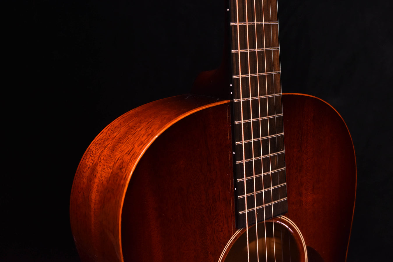 Sunburst acoustic guitar neck and upper bout close-up