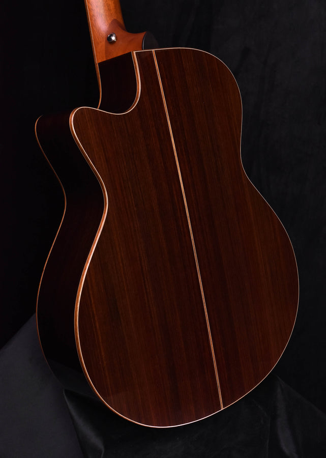 Red-brown cutaway acoustic guitar body with cream binding