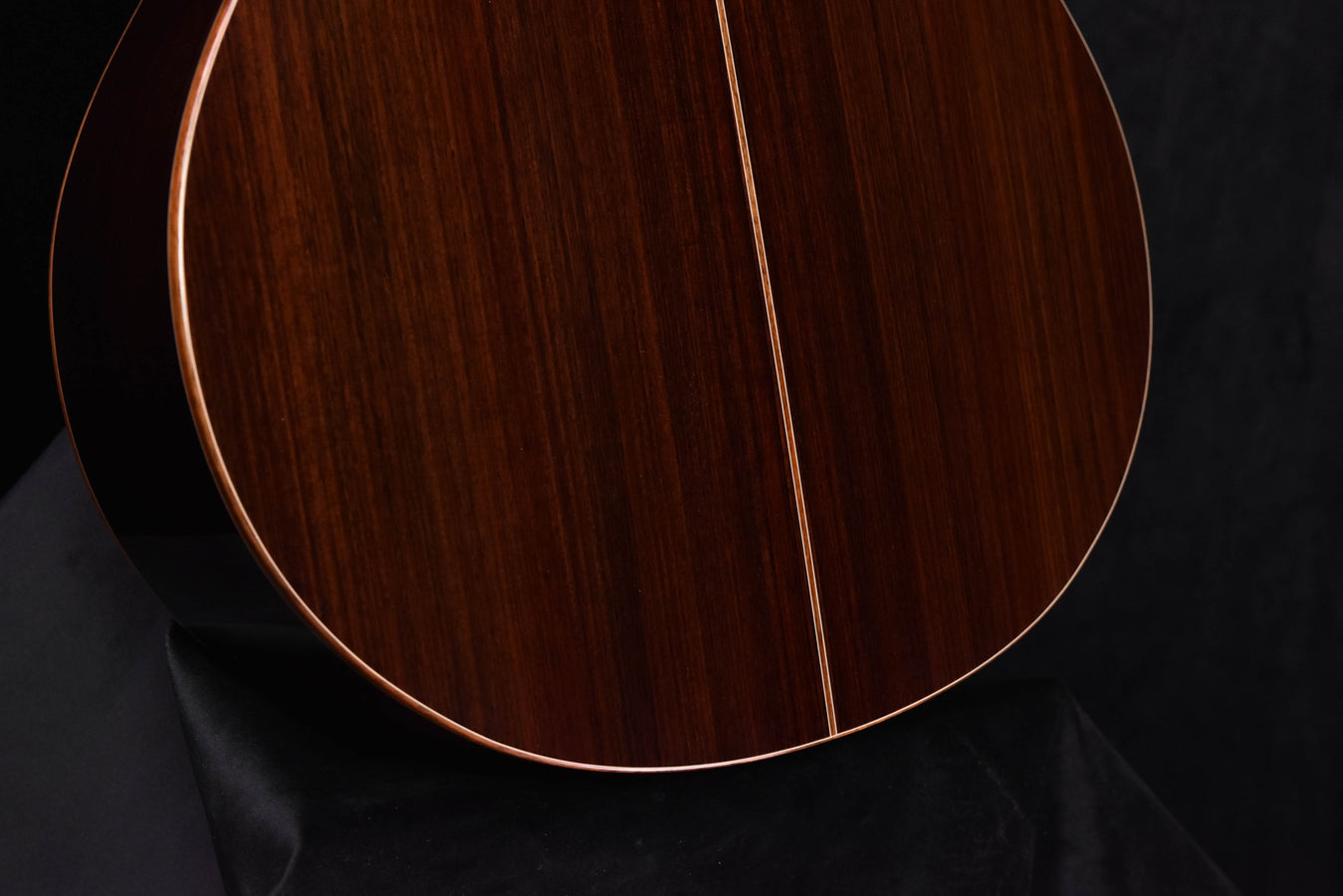 Close-up of guitar soundboard with center seam and cream binding
