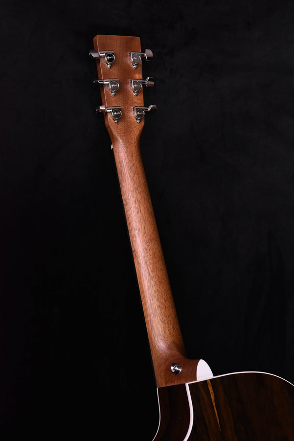 Acoustic-electric guitar headstock with 6 tuning pegs and dark wood neck