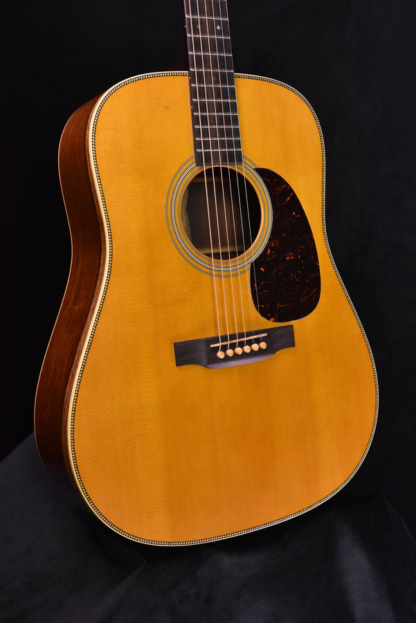 Natural dreadnought acoustic guitar front view, tortoiseshell pickguard, round soundhole rosette
