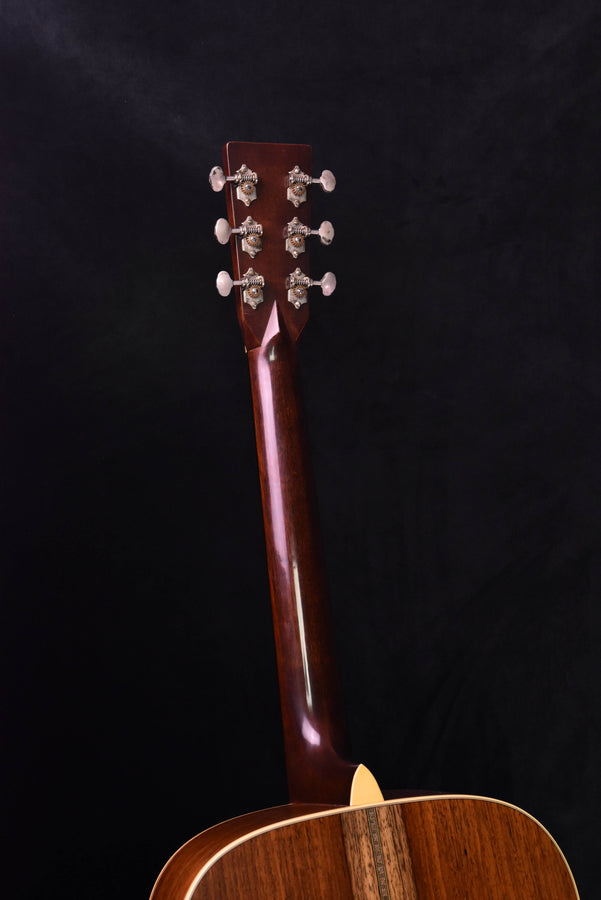 Dreadnought acoustic guitar headstock and upper body, glossy dark finish