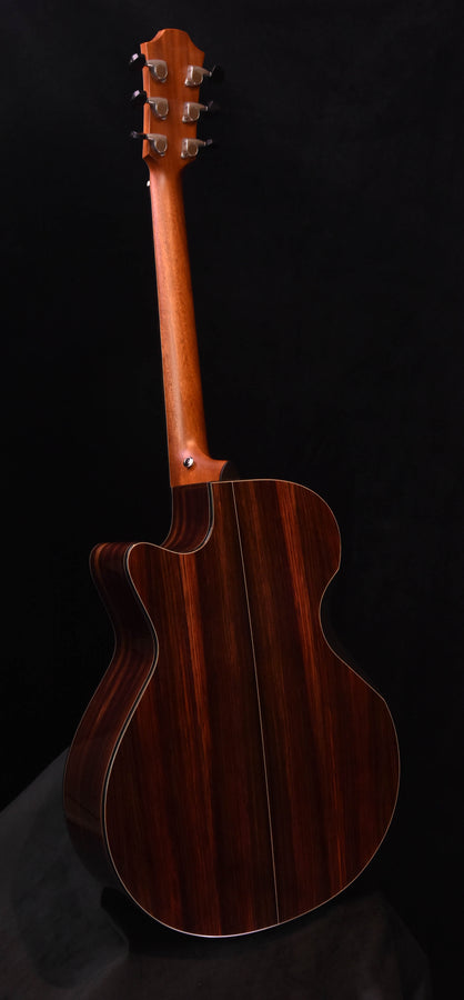 Dark wood acoustic cutaway guitar, headstock and body profile