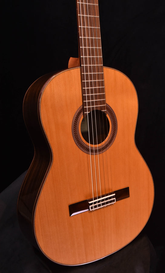 Cedar-top classical nylon-string guitar, close-up of sound hole and rosette
