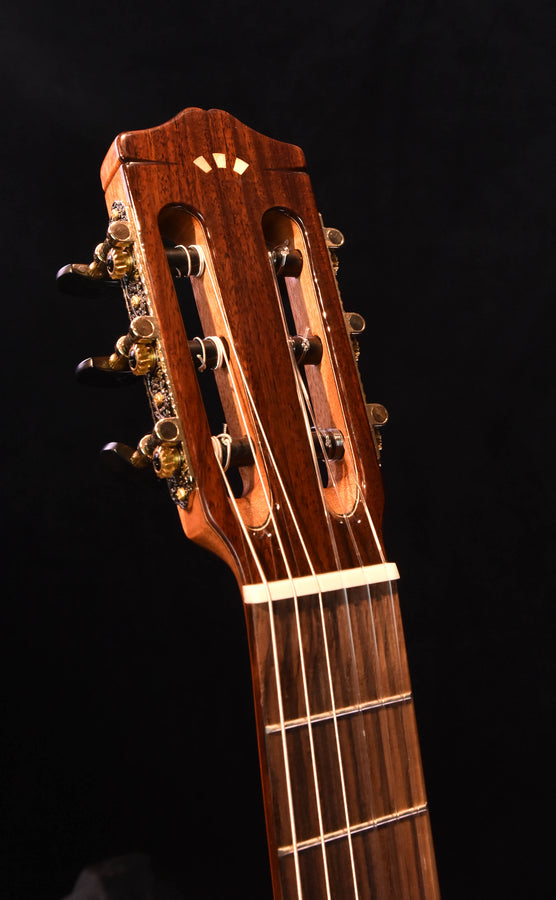 Cordoba C7 headstock with tuning pegs and nut, close-up