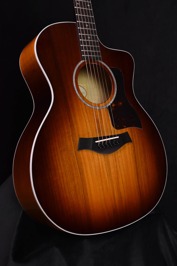 Acoustic-electric guitar, sunburst brown body and rosette around sound hole, front view