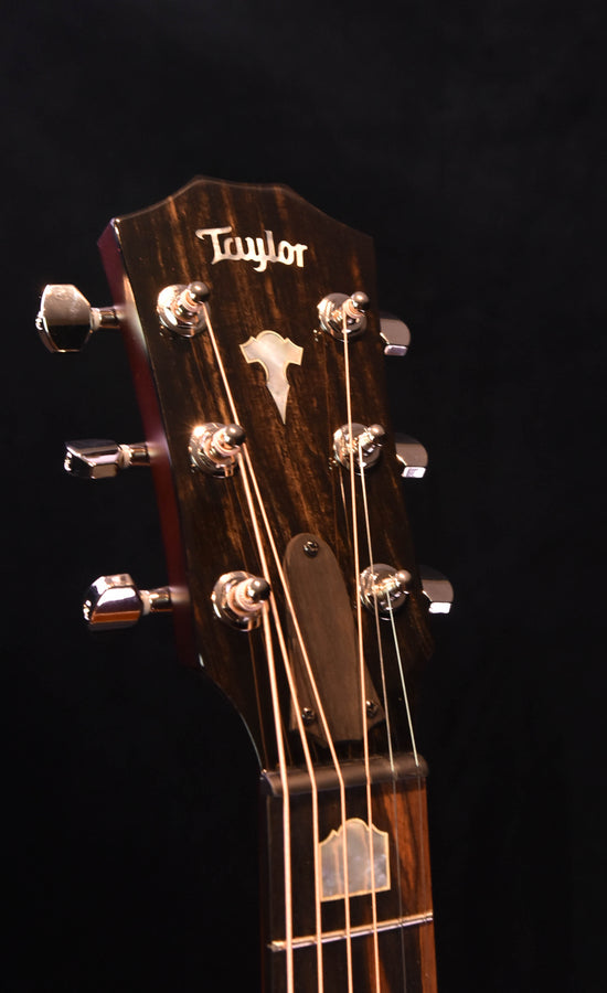 Headstock with Taylor logo and tuning machines, angled close-up
