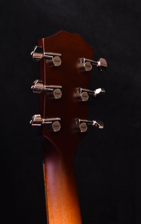 Taylor acoustic guitar headstock, tobacco sunburst finish and six tuning pegs