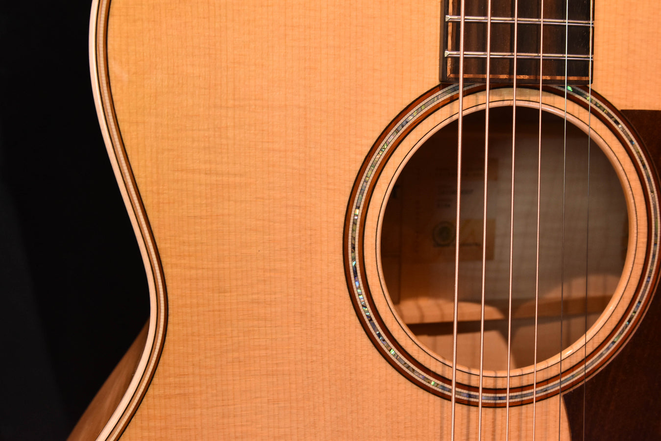 Antique Blonde soundhole with rosette trim on acoustic-electric guitar body