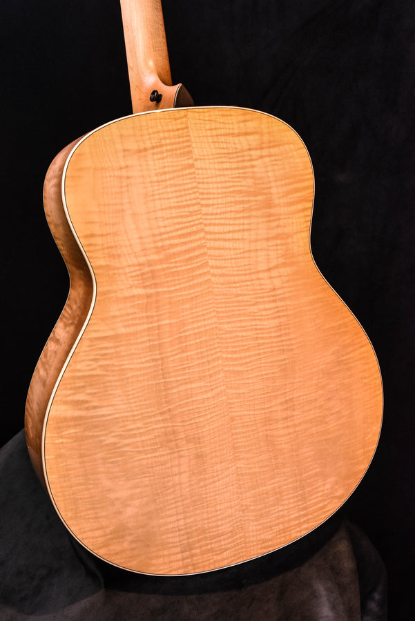 Antique Blonde acoustic-electric guitar back close-up with natural wood grain