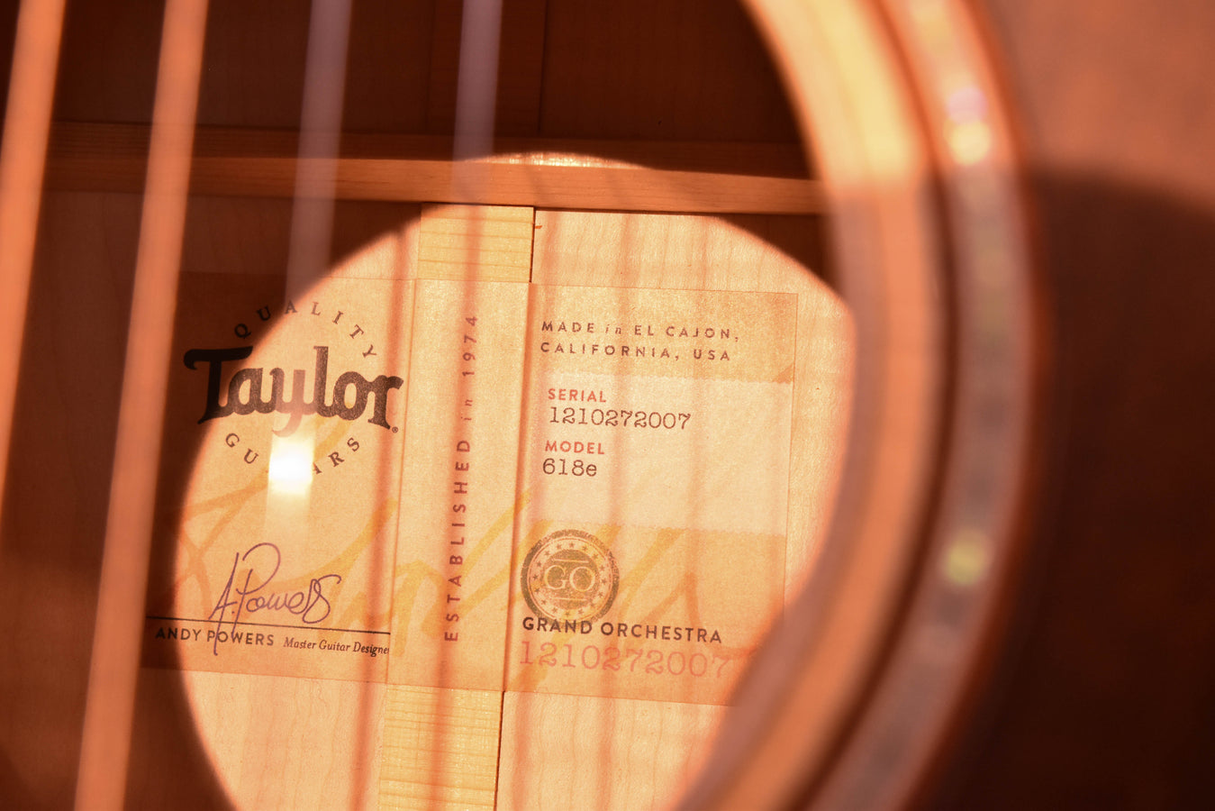 Soundhole label on 618E Grand Orchestra acoustic electric guitar with serial and model
