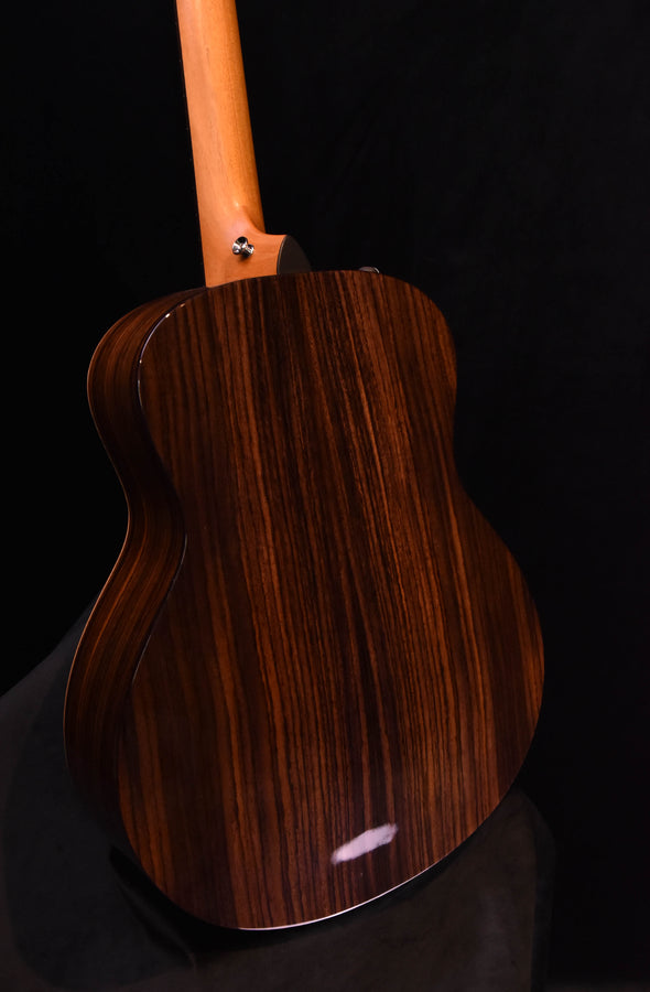 Mini-E guitar back view, dark wood grain with hardware at the neck joint