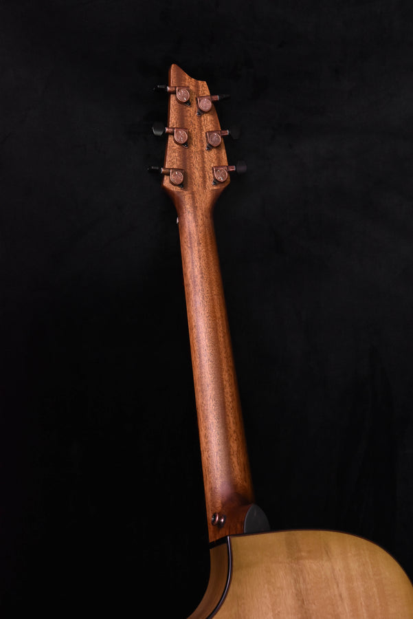 Guitar headstock and neck with tuning pegs in natural wood